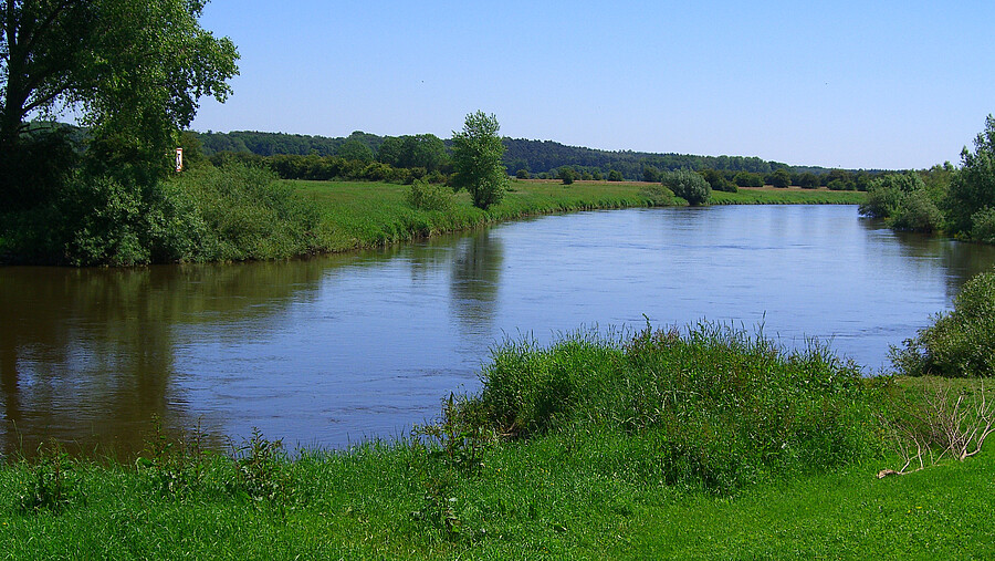 A river through a green landscape.
